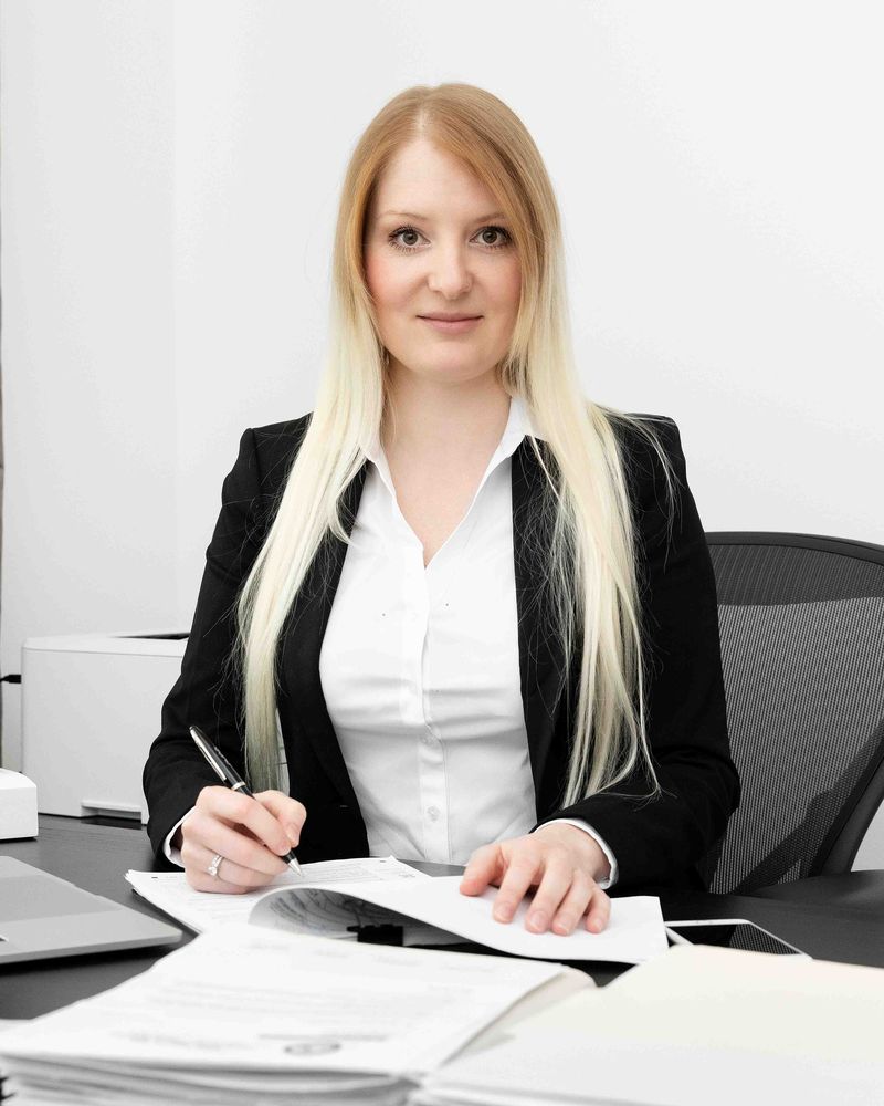 Portrait of Olga Grigoryants, CPA, at her desk
